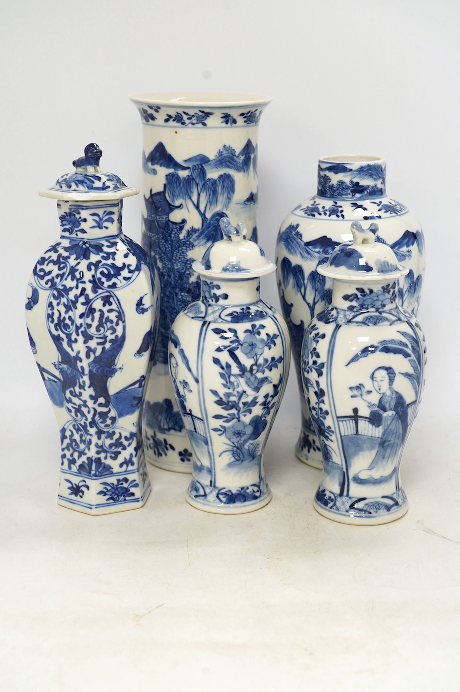 Five blue and white Chinese export porcelain vases, tallest 30cm high. Condition - one cover on a vase is chipped another cover (on pair of vases) is chipped, the three other vases are good